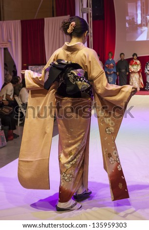 NEW YORK - APRIL 19: Model walks runway for Kimono Fashion Show NYC celebration of Japanese Culture at Grand Central Terminal Vanberbilt Hall on April 19, 2013 in New York City