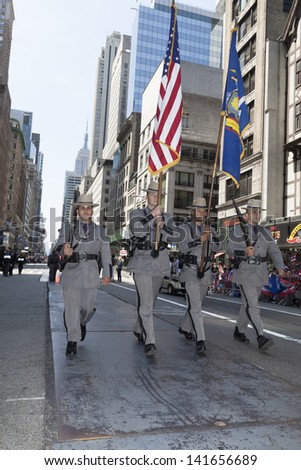 NEW YORK - JUNE 09: New York state troopers march at the National Puerto Rican Day Parade on the streets of Manhattan on June 09, 2013 in New York City