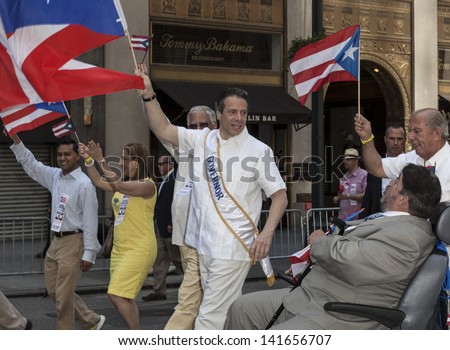 NEW YORK - JUNE 09: New York Governor Andrew Cuomo attends the National Puerto Rican Day Parade on the streets of Manhattan on June 09, 2013 in New York City