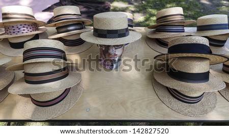 NEW YORK - JUNE 15: Straw hats by Orlando Palacios on display during 8th annual Jazz Age lawn party by Michael Arenella & the Dreamland Orchestra on Governors Island on June 15, 2013 in NYC