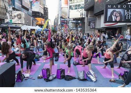 NEW YORK - JUNE 21: Atmosphere during yoga performance sponsored by Athleta to celebrate solstice on Times Square on June 21 2013 in New York
