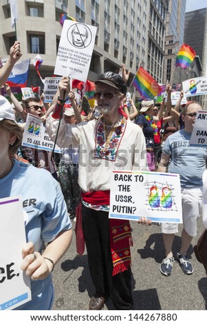NEW YORK - JUNE 30: Protesters against anti-gay policies of Russian government during annual 43rd Pride Parade on Fifth Avenue in Manhattan on June 30, 2013 in New York City