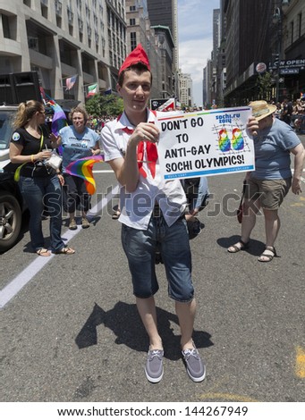 NEW YORK - JUNE 30: Protesters against anti-gay policies of Russian government during annual 43rd Pride Parade on Fifth Avenue in Manhattan on June 30, 2013 in New York City