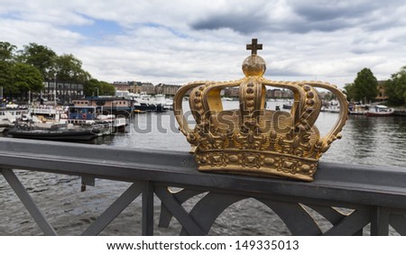 View of canal and bridge with royal crown in Stockholm