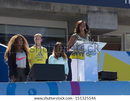 NEW YORK - AUGUST 24: First Lady Michelle Obama speaks on stage while tennis players watch during Arthur Ashe Kids Day presentation at Billie Jean King National Tennis Center on August 24, 2013 in NYC