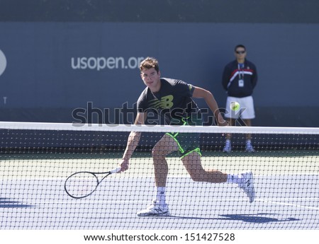 NEW YORK - AUGUST 24: Milos Raonic of Canada practices on practice court 3 at USTA Billie Jean King National Tennis Center on August 24, 2013 in New York City