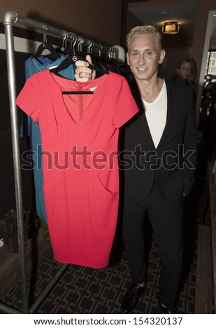 NEW YORK - SEPTEMBER 09: Designer David Meister shows off clothes during Spring/Summer 2014 Fashion week presentation for Home Shopping Network at Empire Hotel on September 09, 2013 in New York City