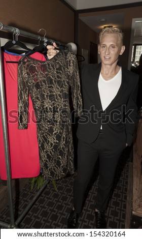 NEW YORK - SEPTEMBER 09: Designer David Meister shows off clothes during Spring/Summer 2014 Fashion week presentation for Home Shopping Network at Empire Hotel on September 09, 2013 in New York City