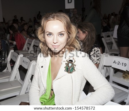 NEW YORK - SEPTEMBER 07: Unidentified woman with bug antique broche attends runway Spring/Summer 2014 Fashion week for Rebecca Taylor collection at Center 548 in Chelsea on September 07, 2013 in NYC