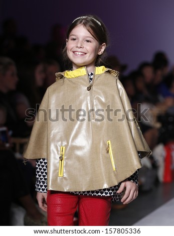NEW YORK - OCTOBER 6: Girl walks runway for Oil & Water by Amy Wismar at Vogue Bambini petiteParade Kids Fashion Week at Industrial Superstudio on October 6, 2013 in New York City