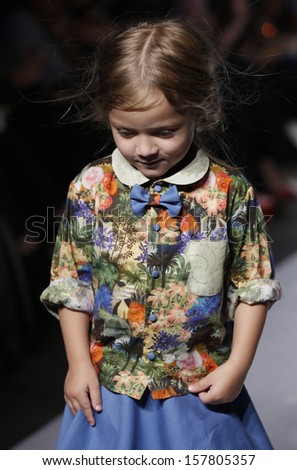 NEW YORK - OCTOBER 6: Girl walks runway for Oil & Water by Amy Wismar at Vogue Bambini petiteParade Kids Fashion Week at Industrial Superstudio on October 6, 2013 in New York City