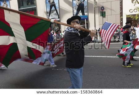 NEW YORK - OCTOBER 14: Basque people in national costumes with flag attend during annual Columbus Day Parade on 5th Avenue on October 14, 2013 in New York City