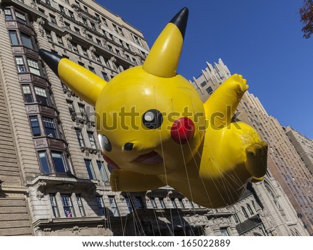 NEW YORK - NOVEMBER 28: Pokemon Pikachu balloon is flown low because of weather condition at the 87th Annual Macy's Thanksgiving Day Parade on November 28, 2013 in New York City.