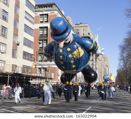 NEW YORK - NOVEMBER 28: Harold the Policeman balloon is flown low because of weather condition at the 87th Annual Macy\'s Thanksgiving Day Parade on November 28, 2013 in New York City.