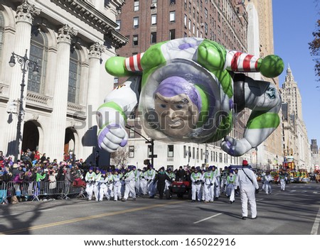 NEW YORK - NOVEMBER 28: Buzz Lightyear balloon is flown low because of weather condition at the 87th Annual Macy\'s Thanksgiving Day Parade on November 28, 2013 in New York City.