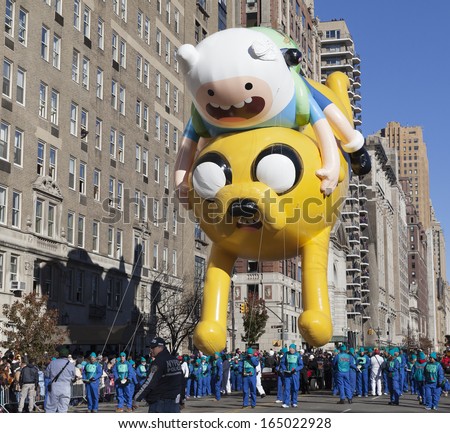 NEW YORK - NOVEMBER 28: Finn & Jake balloon is flown low because of weather condition at the 87th Annual Macy\'s Thanksgiving Day Parade on November 28, 2013 in New York City.