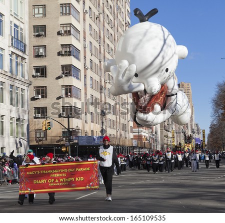 NEW YORK - NOVEMBER 28: Diary of Wimpy Kid balloon is flown low because of weather condition at the 87th Annual Macy\'s Thanksgiving Day Parade on November 28, 2013 in New York City.