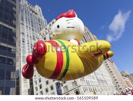 NEW YORK - NOVEMBER 28: Hello Kitty balloon is flown low because of weather condition at the 87th Annual Macy\'s Thanksgiving Day Parade on November 28, 2013 in New York City.