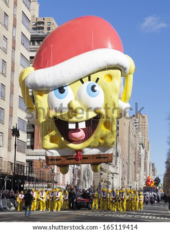 NEW YORK - NOVEMBER 28: Spongebob Squarepants balloon is flown low because of weather condition at the 87th Annual Macy\'s Thanksgiving Day Parade on November 28, 2013 in New York City.