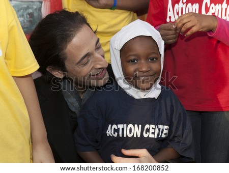 NEW YORK - DECEMBER 20: Adrien Brody attends The Action Center\'s Post-Sandy Holiday Party at The Action Center presented by Bulgari & Save the Children on Dec 20, 2013 in Far Rockaway of Queens in NYC