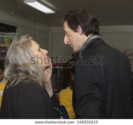 NEW YORK - DEC 20: Adrien Brody & Sylvia Plachy attend Action Center Post-Sandy Holiday Party at The Action Center presented by Bulgari & Save the Children on Dec 20, 2013 in Far Rockaway Queens in NY