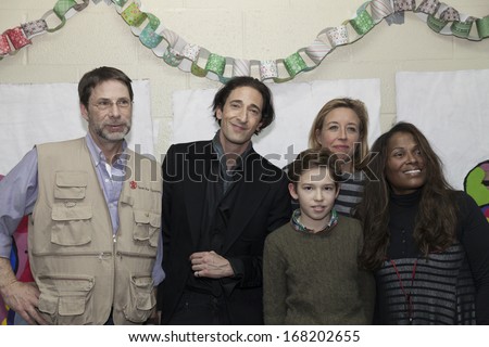 NEW YORK - DEC 20: Adrien Brody & guests attend Action Center Post-Sandy Holiday Party at The Action Center presented by Bulgari & Save the Children on Dec 20, 2013 in Far Rockaway of Queens in NYC