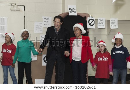 NEW YORK - DEC 20: Adrien Brody & kids attend Action Center Post-Sandy Holiday Party at The Action Center presented by Bulgari & Save the Children on Dec 20, 2013 in Far Rockaway of Queens in NYC