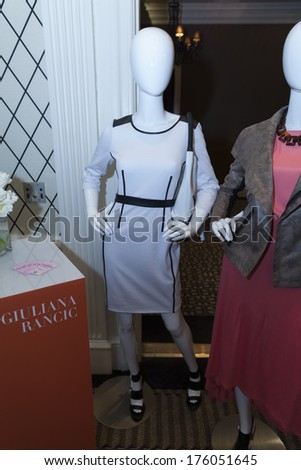 NEW YORK, NY - FEBRUARY 10, 2014: Women dresses by Jiuliana Rancic on display for Home Shopping Network during New York Fall/Winter 2014 fashion week at Empire Hotel Crystal Room