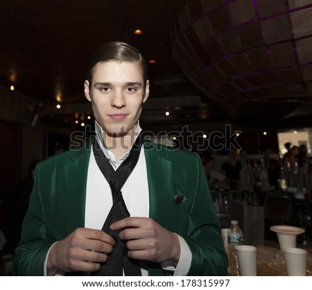 NEW YORK, NY - FEBRUARY 11, 2014: Model prepairs backstage for Dinner with Edward presentation by Malan Breton at Fall/Winter 2014 Fashion week at 510 West 42nd street
