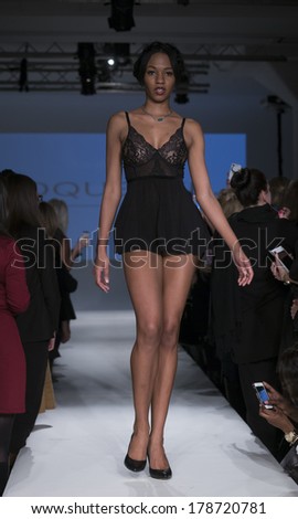 NEW YORK, NY - FEBRUARY 24, 2014: Model walks runway for Lingerie fashion night IN show by Coquette during CurveExpo at Tribeca Skyline Studios
