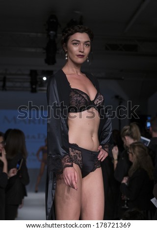 NEW YORK, NY - FEBRUARY 24, 2014: Model walks runway for Lingerie fashion night IN show by Marie Jo PrimaDonna during CurveExpo at Tribeca Skyline Studios