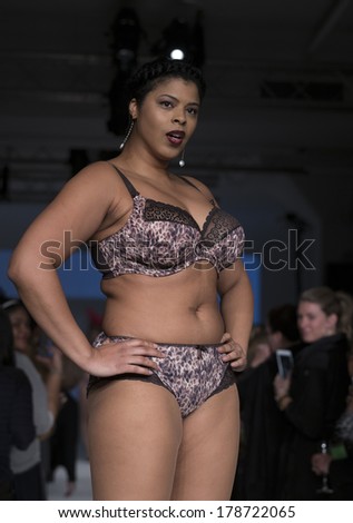 NEW YORK, NY - FEBRUARY 24, 2014: Model walks runway for Lingerie fashion night IN show by Curvy Couture during CurveExpo at Tribeca Skyline Studios