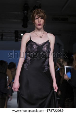 NEW YORK, NY - FEBRUARY 24, 2014: Model walks runway for Lingerie fashion night IN show by Josie Natori during CurveExpo at Tribeca Skyline Studios