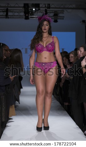 NEW YORK, NY - FEBRUARY 24, 2014: Model walks runway for Lingerie fashion night IN show by Curvy Couture during CurveExpo at Tribeca Skyline Studios