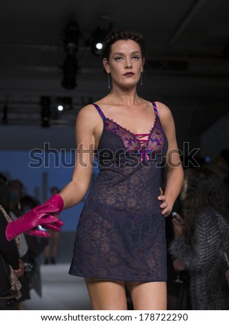 NEW YORK, NY - FEBRUARY 24, 2014: Model walks runway for Lingerie fashion night IN show by Aubade during CurveExpo at Tribeca Skyline Studios