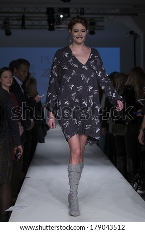 NEW YORK, NY - FEBRUARY 24, 2014: Model walks runway for Lingerie fashion night IN show by Pluto on the Moon during CurveExpo at Tribeca Skyline Studios
