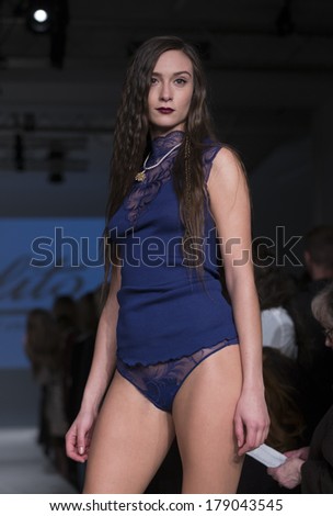 NEW YORK, NY - FEBRUARY 24, 2014: Model walks runway for Lingerie fashion night IN show by Oscalito during CurveExpo at Tribeca Skyline Studios