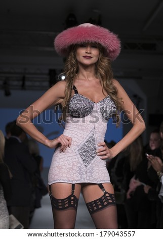 NEW YORK, NY - FEBRUARY 24, 2014: Model walks runway for Lingerie fashion night IN show by Rago during CurveExpo at Tribeca Skyline Studios