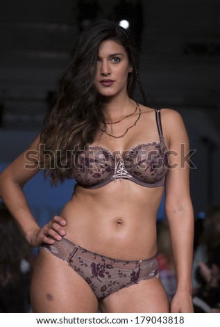 NEW YORK, NY - FEBRUARY 24, 2014: Model walks runway for Lingerie fashion night IN show by Empreinte during CurveExpo at Tribeca Skyline Studios
