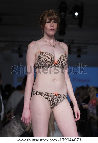 NEW YORK, NY - FEBRUARY 24, 2014: Model walks runway for Lingerie fashion night IN show by Fantasie, Huit, Freya, Elomi during CurveExpo at Tribeca Skyline Studios