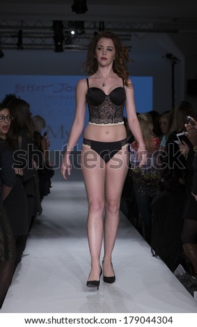 NEW YORK, NY - FEBRUARY 24, 2014: Model walks runway for Lingerie fashion night IN show by Betsey Johnson during CurveExpo at Tribeca Skyline Studios