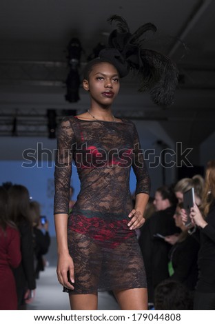 NEW YORK, NY - FEBRUARY 24, 2014: Model walks runway for Lingerie fashion night IN show by Vannina Vesperini during CurveExpo at Tribeca Skyline Studios