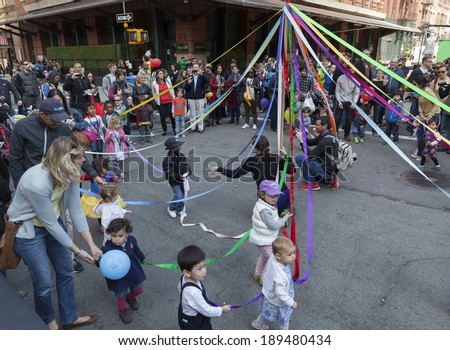 NEW YORK, NY - APRIL 26, 2014: Kids and parents play at Family festival during the 2014 Tribeca Film festival on Greenwich street