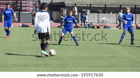 NEW YORK, NY - MAY 31, 2014: South Bronx United 01 team plays against Brooklyn Chernomorets team as part of Cosmopolitan Junior Soccer League Under 12 at Macombs Dam Field the Bronx