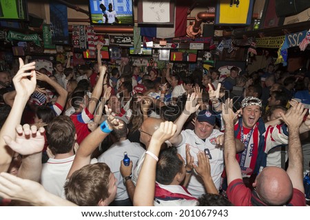 New York, NY USA - JUNE 26: Fans of the United States Men\'s National Soccer Team celebrate after United States advanced to second round of World Cup inside Legends sport Bar