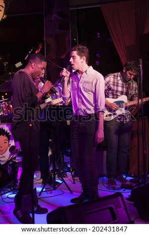 NEW YORK, NY - JUNE 30, 2014: Sam Given, Ano Okera perform at Broadway Sings For Pride benefit concert at Toshi's Living Room at The Flatiron Hotel