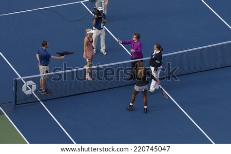 NEW YORK, NY - SEPTEMBER 7, 2014: Billie Jean King tosses coin at final between  Caroline Wozniacki of Denmark and Serena WIlliams of USA at US Open championship in Flushing Meadows USTA Tennis Center