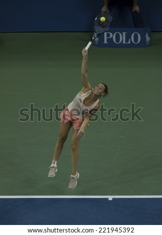 NEW YORK, NY - SEPTEMBER 3, 2014: Flavia Pennetta of Italy serves ball during quarterfinal match against Serena Williams of USA at US Open championship in Flushing Meadows USTA Tennis Center