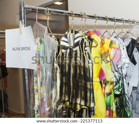 New York, NY - October 18, 2014: Dresses by Alivia Simone on rack at backstage for PetiteParade Kids Fashion week at Bath House Studios