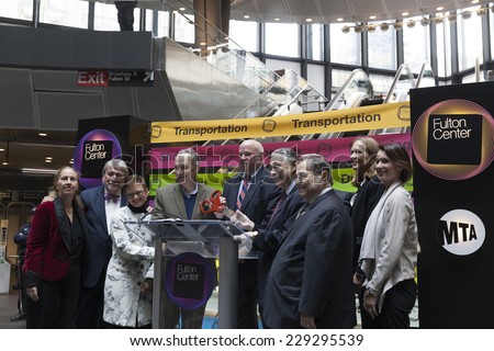 New York, NY - November 9, 2014: Cutting ribbon during opening ceremony of Fulton Center unveiled by Metropolitan Transit Authority during opening ceremony on Broadway in Manhattan